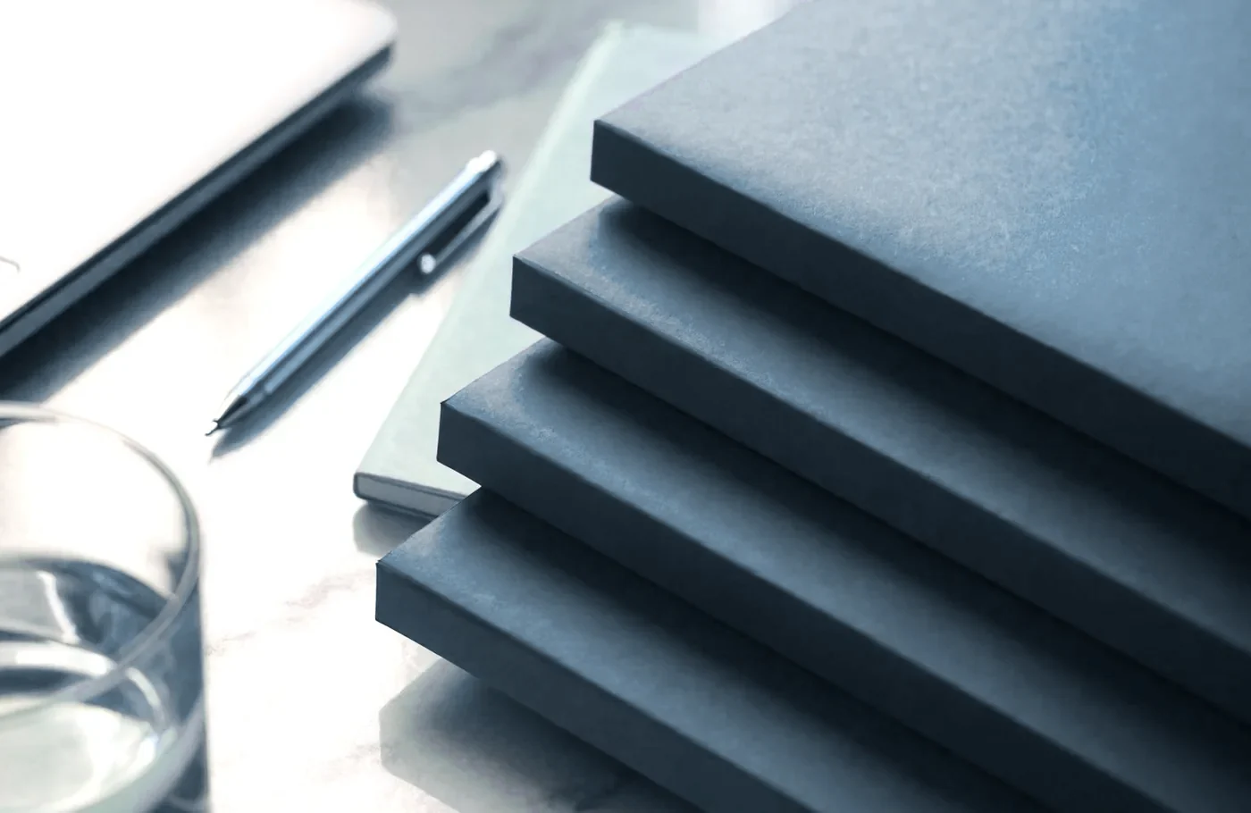 Neatly stacked file folders on a bright desk representing organized business records